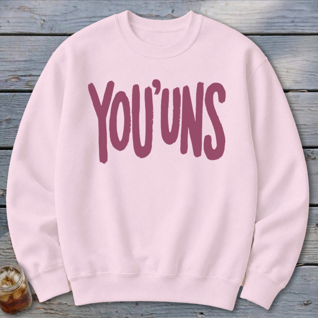 Light pink sweatshirt with bold maroon text reading "YOU'UNS."