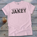 Pink t-shirt with "LOOKING A LITTLE JAKEY" in black text.