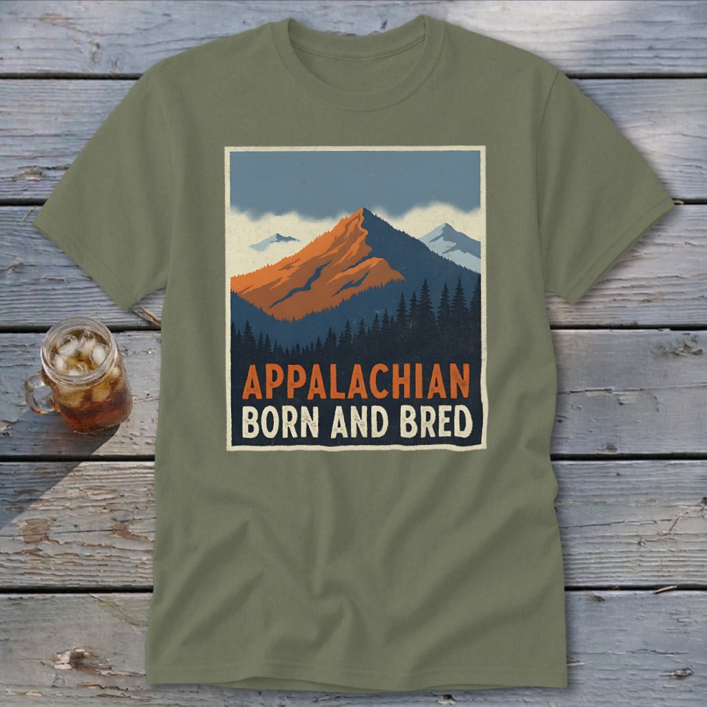 An olive green crewneck t-shirt featuring a retro mountain graphic with the text Appalachian Born and Bred.
