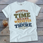 White t-shirt with "Mountain Time Means Whenever We Get There" text and clock graphic.