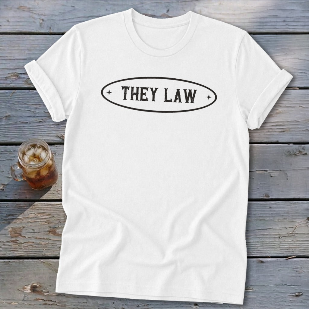 White t-shirt with oval graphic text: THEY LAW