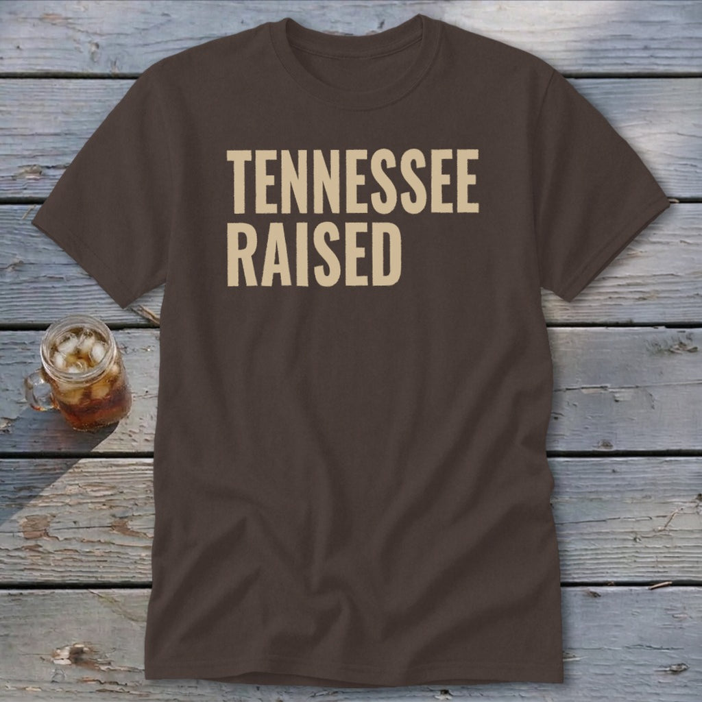 Brown t-shirt with tan text "TENNESSEE RAISED" and a glass of iced tea.