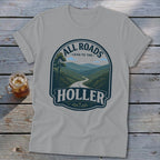 Gray t-shirt with "All Roads Lead To The Holler" mountain landscape design.