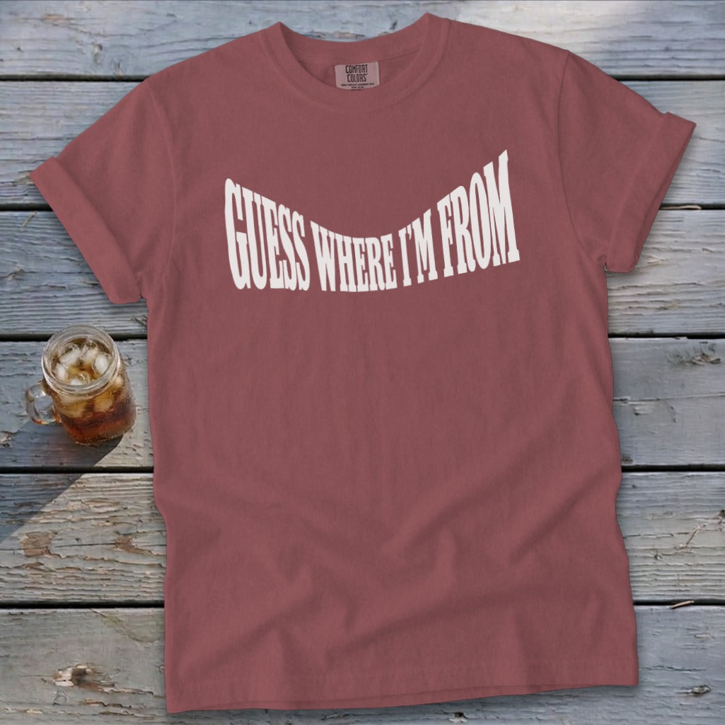 Rose t-shirt with white text "GUESS WHERE I'M FROM" in a curved font.