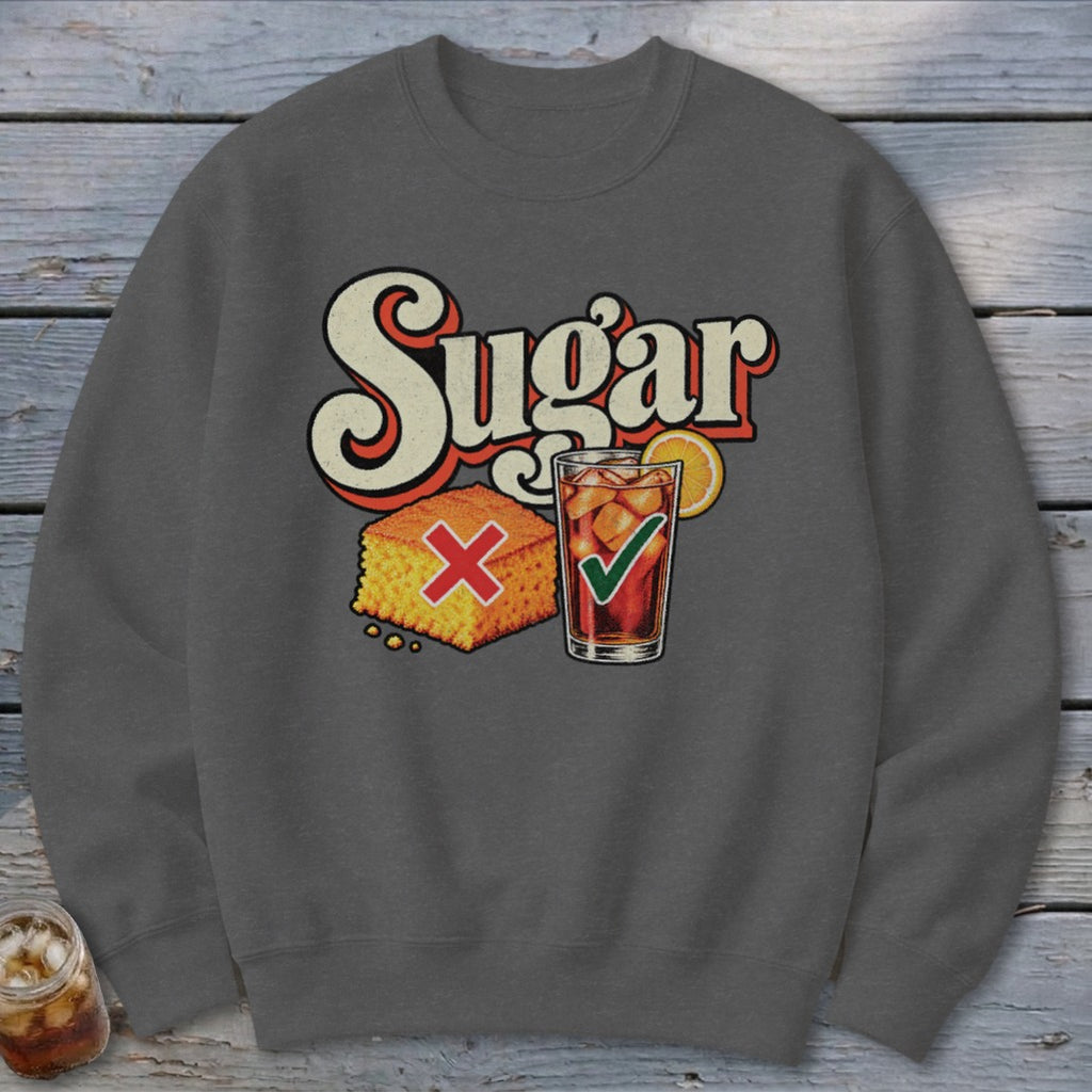 A dark gray crewneck sweatshirt featuring a graphic with the text Sugar, a cornbread piece with a red X, and a glass of iced tea with a green checkmark.