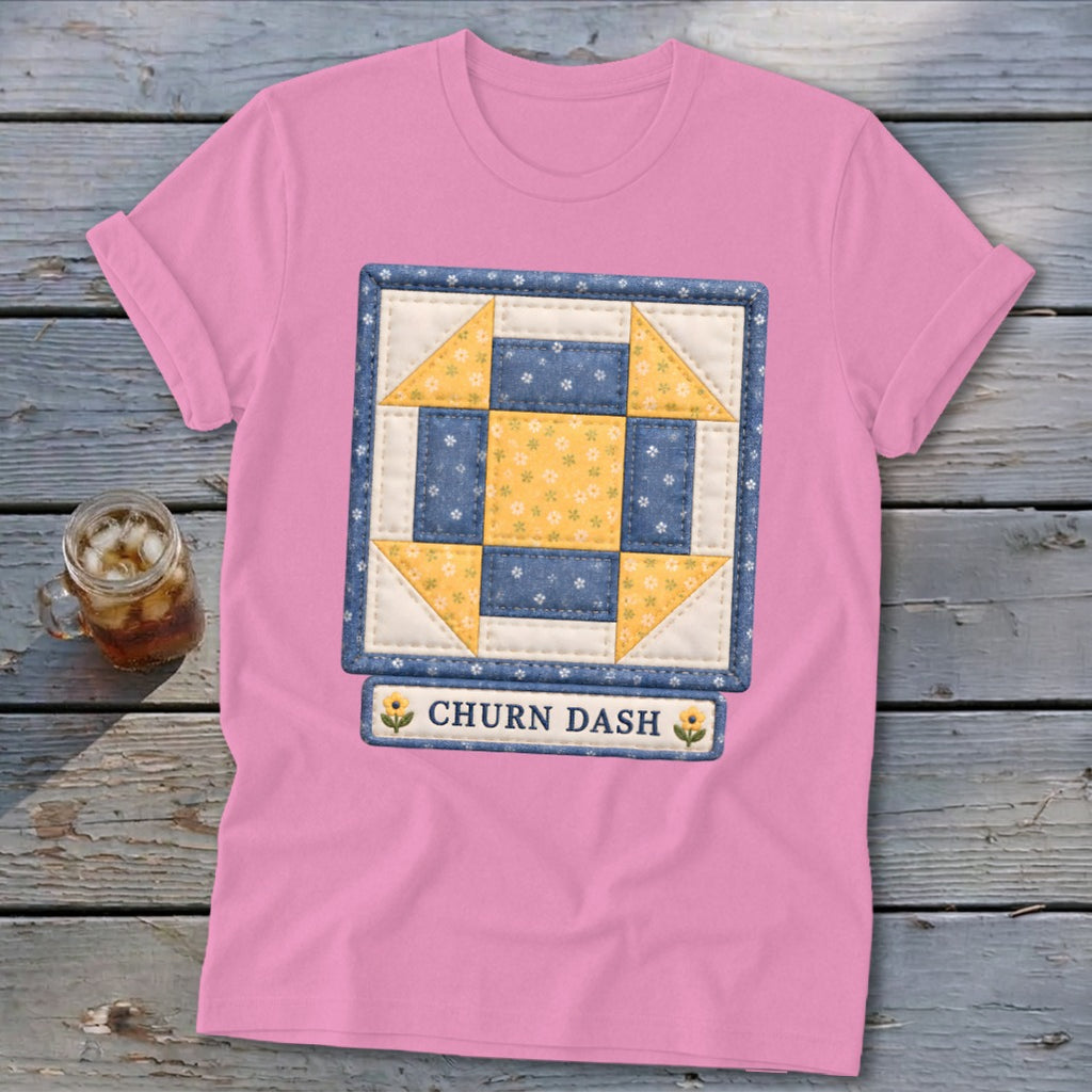 Pink t-shirt with a Churn Dash quilt block design and text.