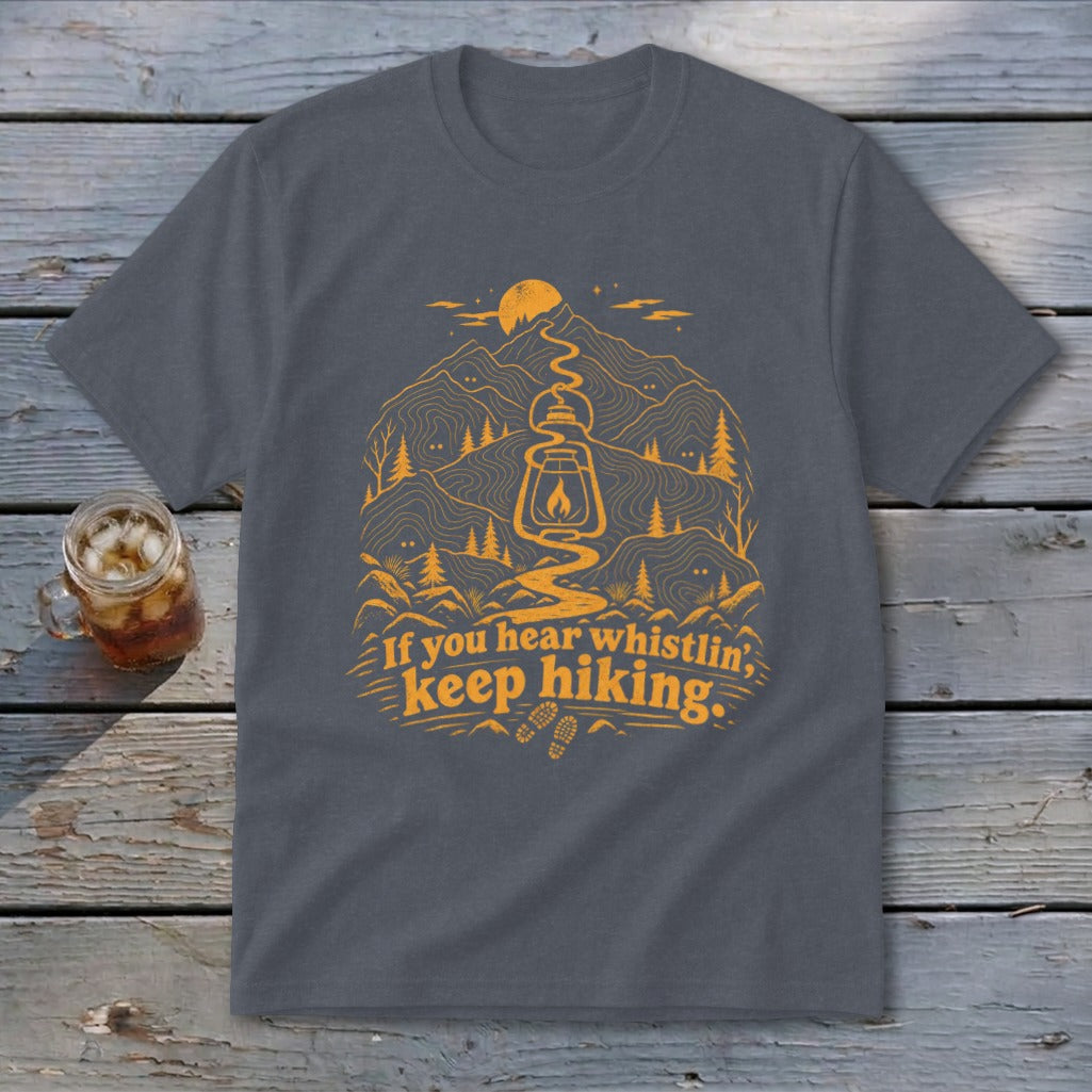 Dark gray t-shirt with orange mountain, lantern, and trail graphic with text.