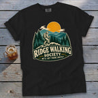 Black t-shirt with "Ridge Walking Society" logo featuring a hiker on a mountain.