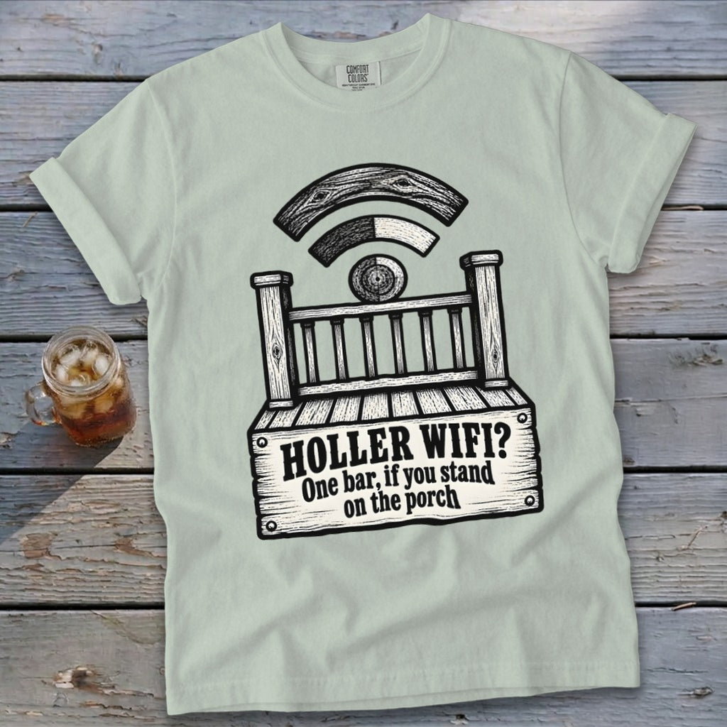 A light green t-shirt with a black graphic of a porch, a Wi-Fi symbol, and the text "HOLLER WIFI? One bar, if you stand on the porch".