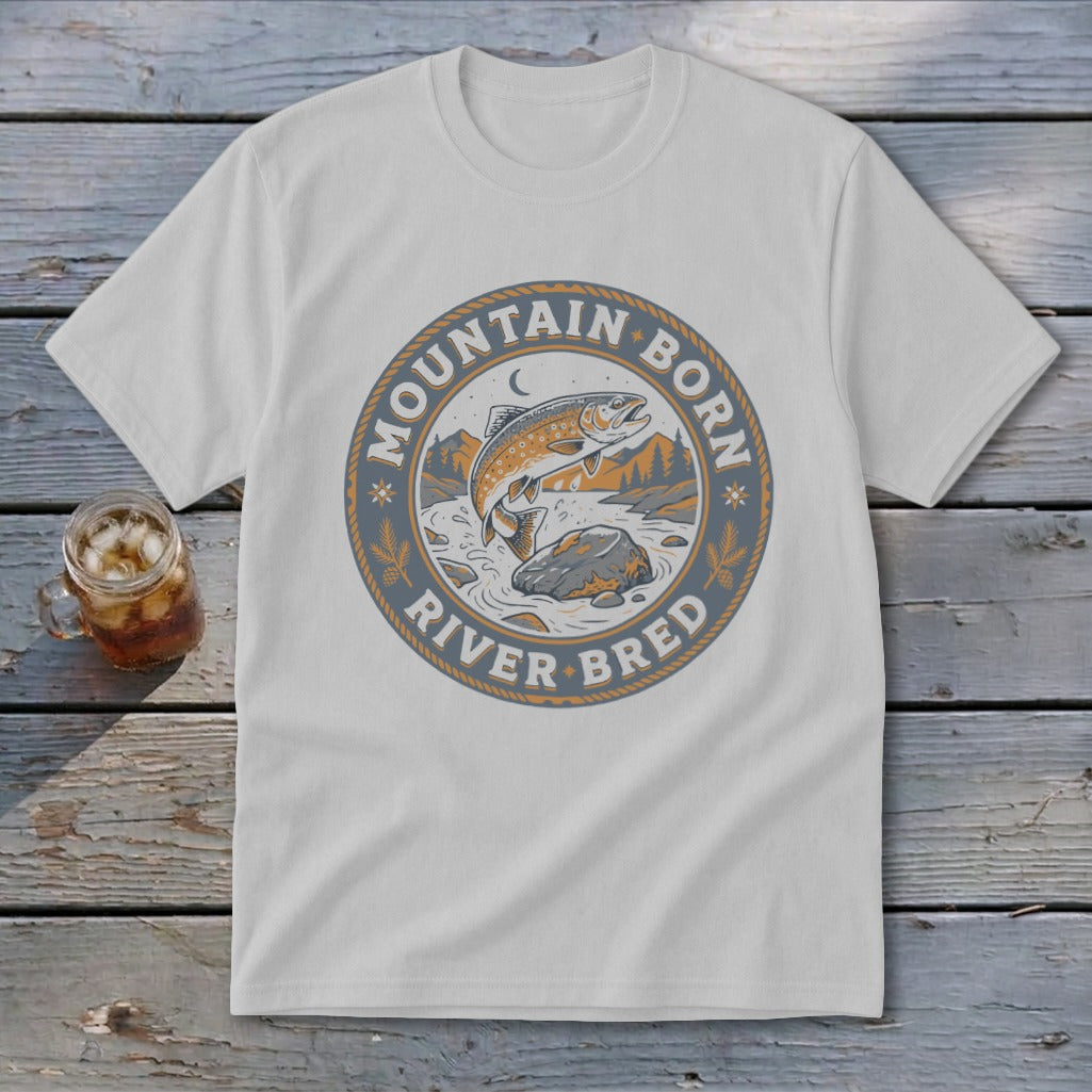 White t-shirt with a circular graphic depicting a jumping trout and the text "Mountain Born River Bred".