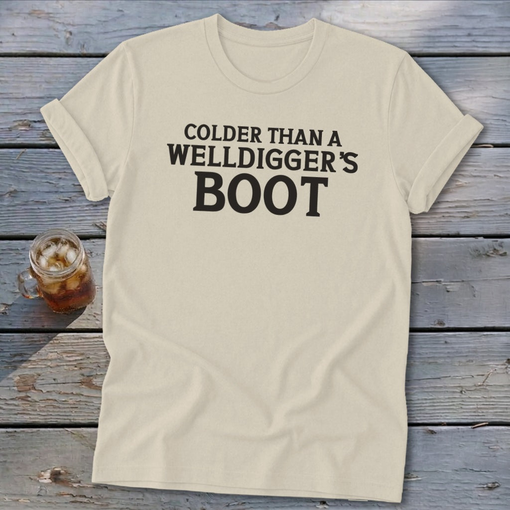 Cream t-shirt with black text reading "COLDER THAN A WELLDIGGER'S BOOT".