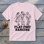 Pink t-shirt with black graphic of three people dancing and "FLAT-FOOT DANCING" text.
