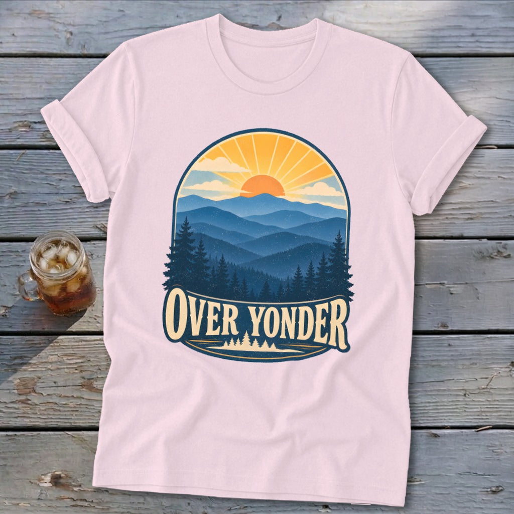 Light pink short-sleeve t-shirt with a retro mountain landscape graphic and the text OVER YONDER.
