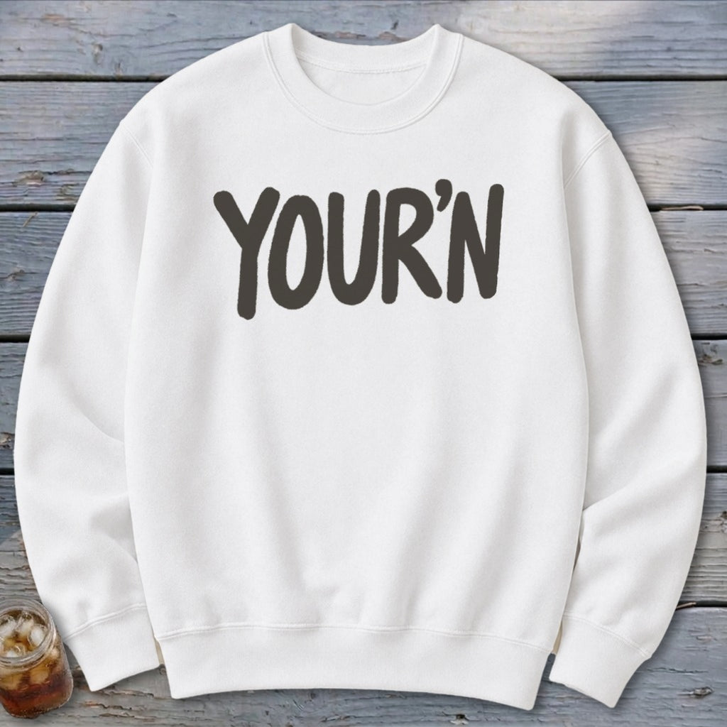 White sweatshirt with dark gray "YOUR'N" text centered on the chest.