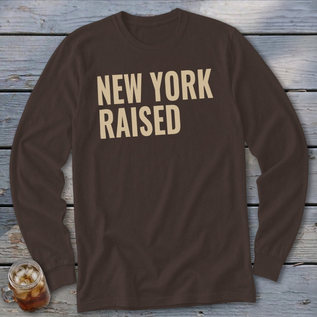 Brown long-sleeve shirt with beige text reading "NEW YORK RAISED."