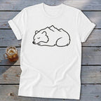 White t-shirt with a minimalist black line drawing of a sleeping bear with mountains on its back.
