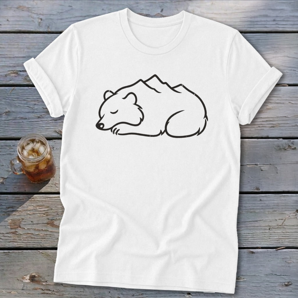 White t-shirt with a minimalist black line drawing of a sleeping bear with mountains on its back.
