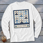 White long-sleeve shirt with a blue and grey Flying Geese quilt block design.