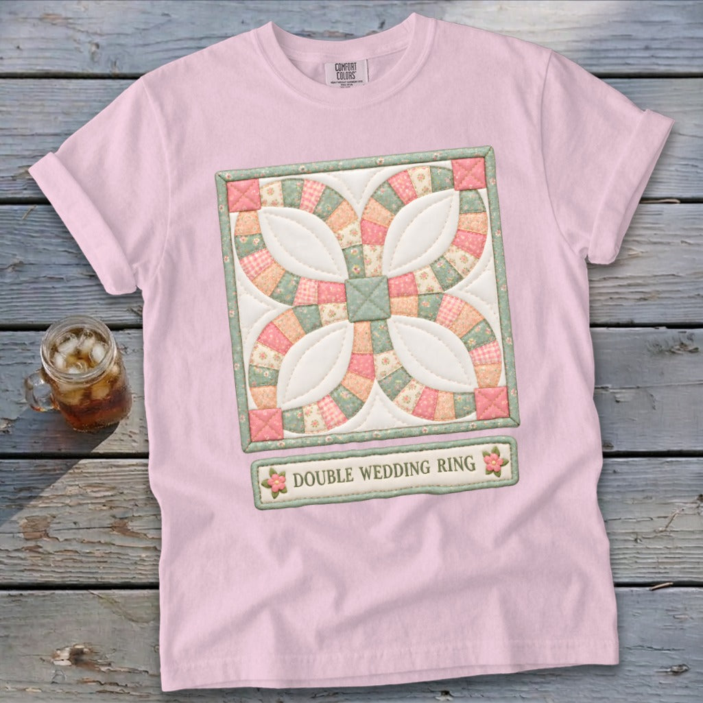 Pink t-shirt with a double wedding ring quilt block graphic and text.