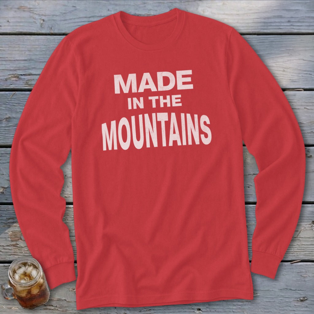 Red long-sleeve shirt with white text reading "MADE IN THE MOUNTAINS".