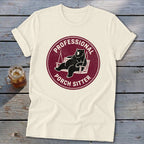 Cream t-shirt with a maroon circular graphic featuring a bear relaxing on a porch swing and the text Professional Porch Sitter.