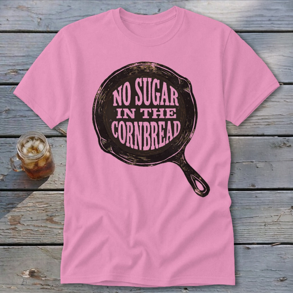 Pink t-shirt with a cast iron skillet graphic that reads "No Sugar in the Cornbread".
