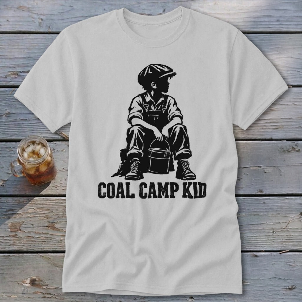 T-shirt with black graphic of a boy sitting with a bucket, text reads "COAL CAMP KID".