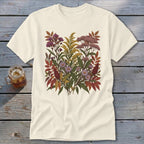 Cream t-shirt with a botanical illustration of autumn wildflowers and leaves.