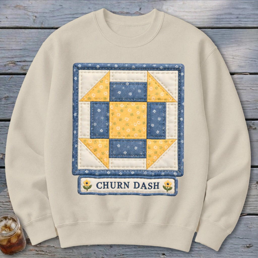 Cream sweatshirt with a square quilt block featuring blue and yellow floral patterns.