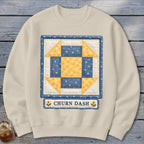 Cream sweatshirt with a square quilt block featuring blue and yellow floral patterns.
