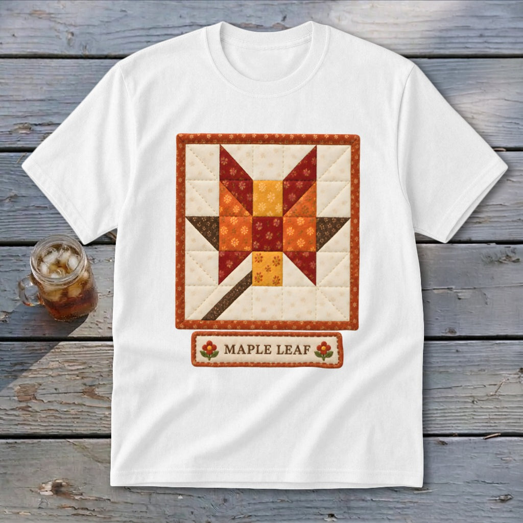 White t-shirt with a quilted maple leaf block design and "MAPLE LEAF" text label.