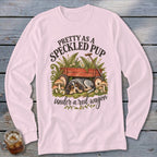 Pink long-sleeve shirt with a speckled pup sleeping under a red wagon.