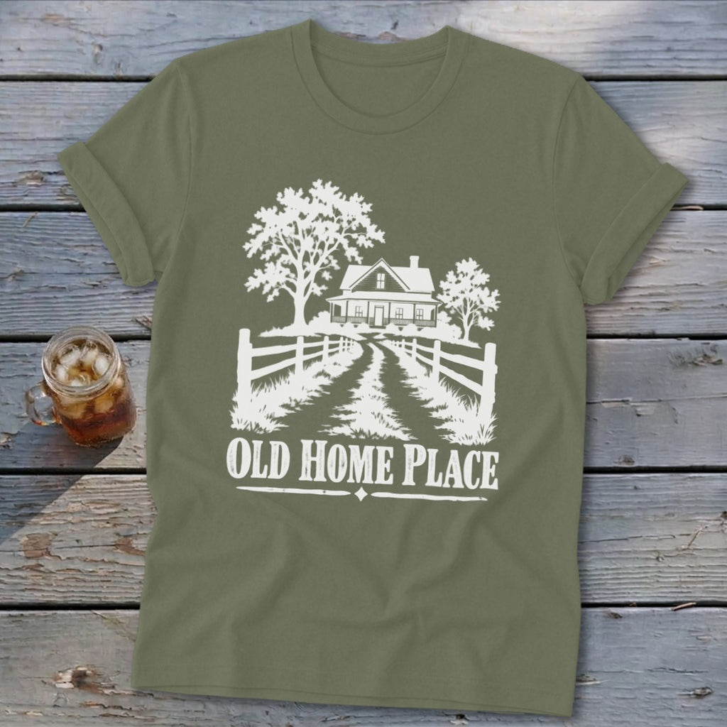 Olive green t-shirt with white graphic of a farmhouse, trees, and fence with text "OLD HOME PLACE".
