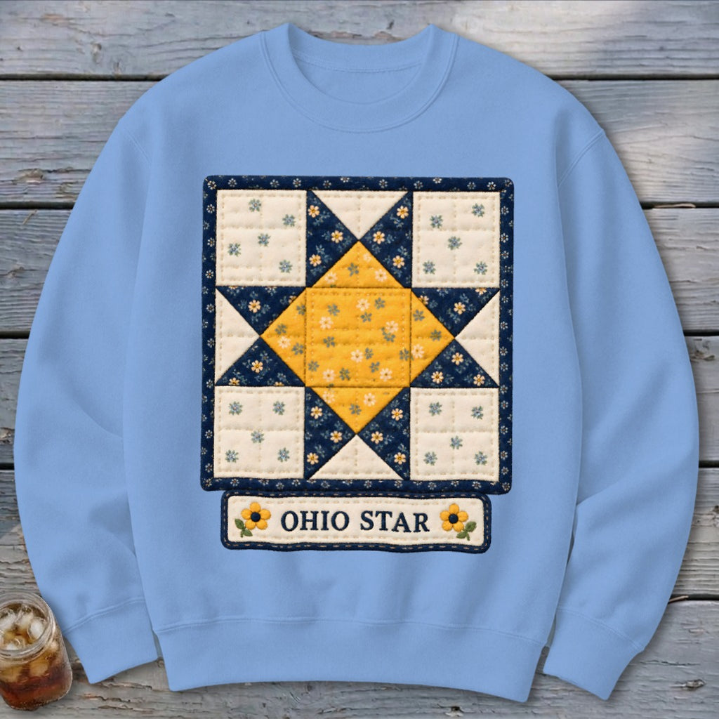 Light blue sweatshirt with a quilt square featuring a yellow Ohio Star and "OHIO STAR" text.