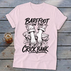 Pink t-shirt with graphic art of bare feet on rocks, "Barefoot on the Crick Bank" text.