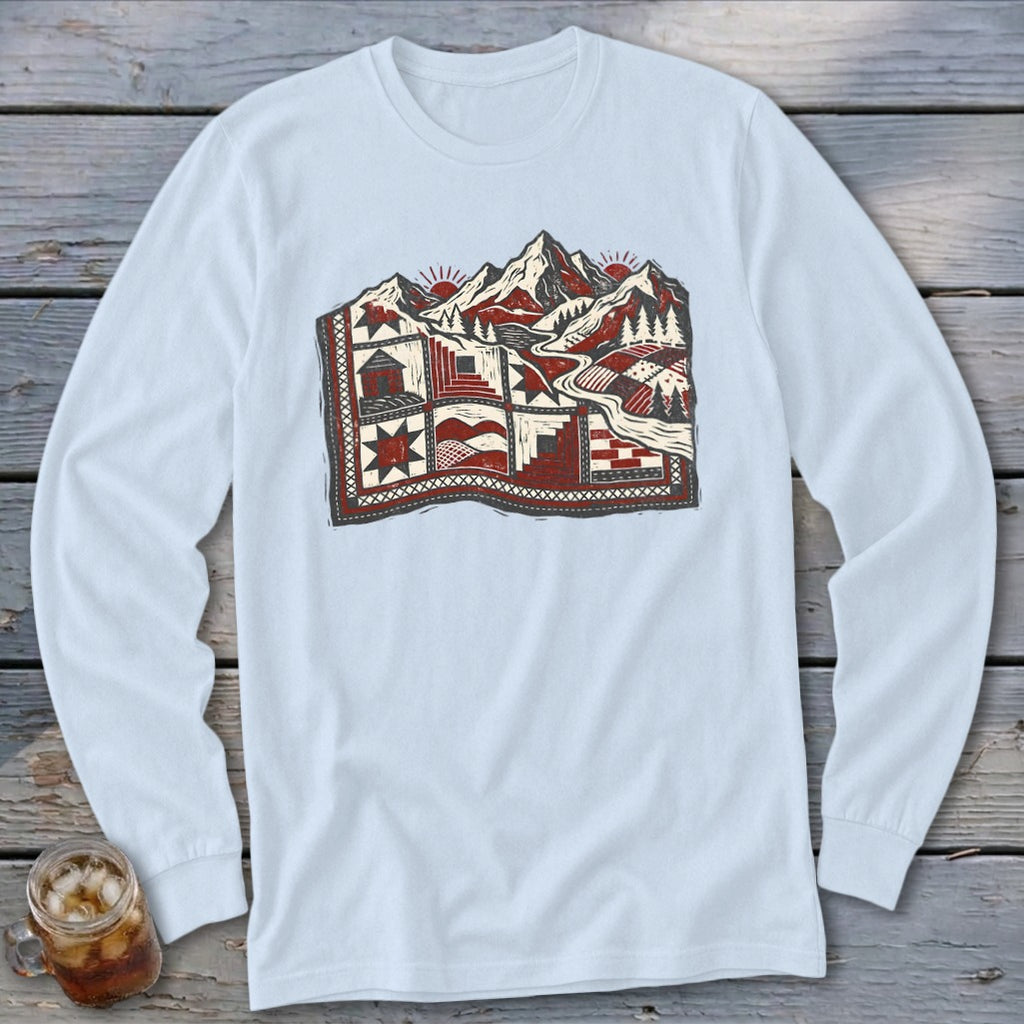 Light blue long-sleeve t-shirt with a red and gray graphic of mountains and patchwork quilt.