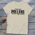 Cream t-shirt with black text that reads "THESE HOLLERS know my name".