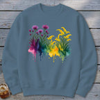 Sweatshirt with watercolor floral print and multi-colored paint splatters.