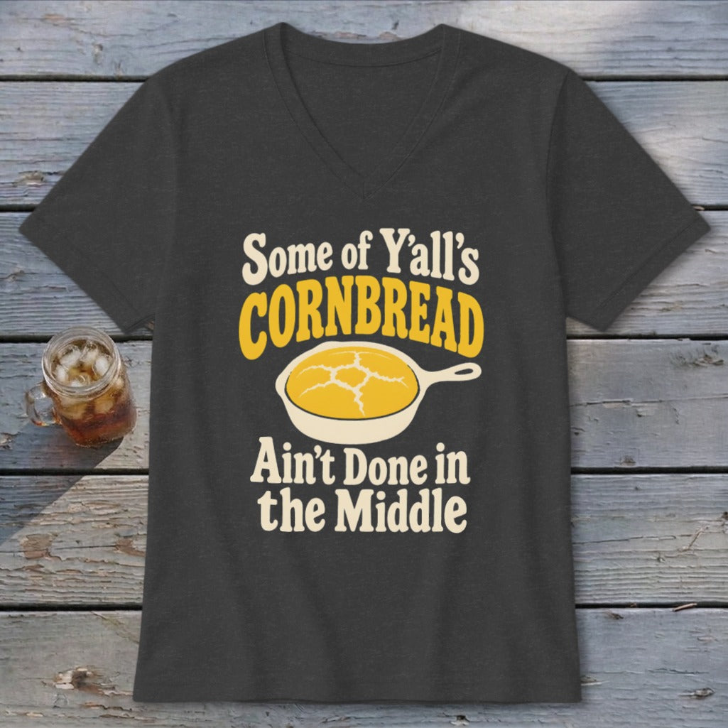 A charcoal gray v-neck t-shirt featuring text and a graphic of cornbread in a skillet.