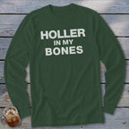 Green long-sleeve shirt with white text reading "Holler In My Bones".