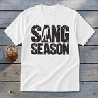 A white short-sleeved t-shirt with black distressed text reading SANG SEASON and a graphic of a digger.
