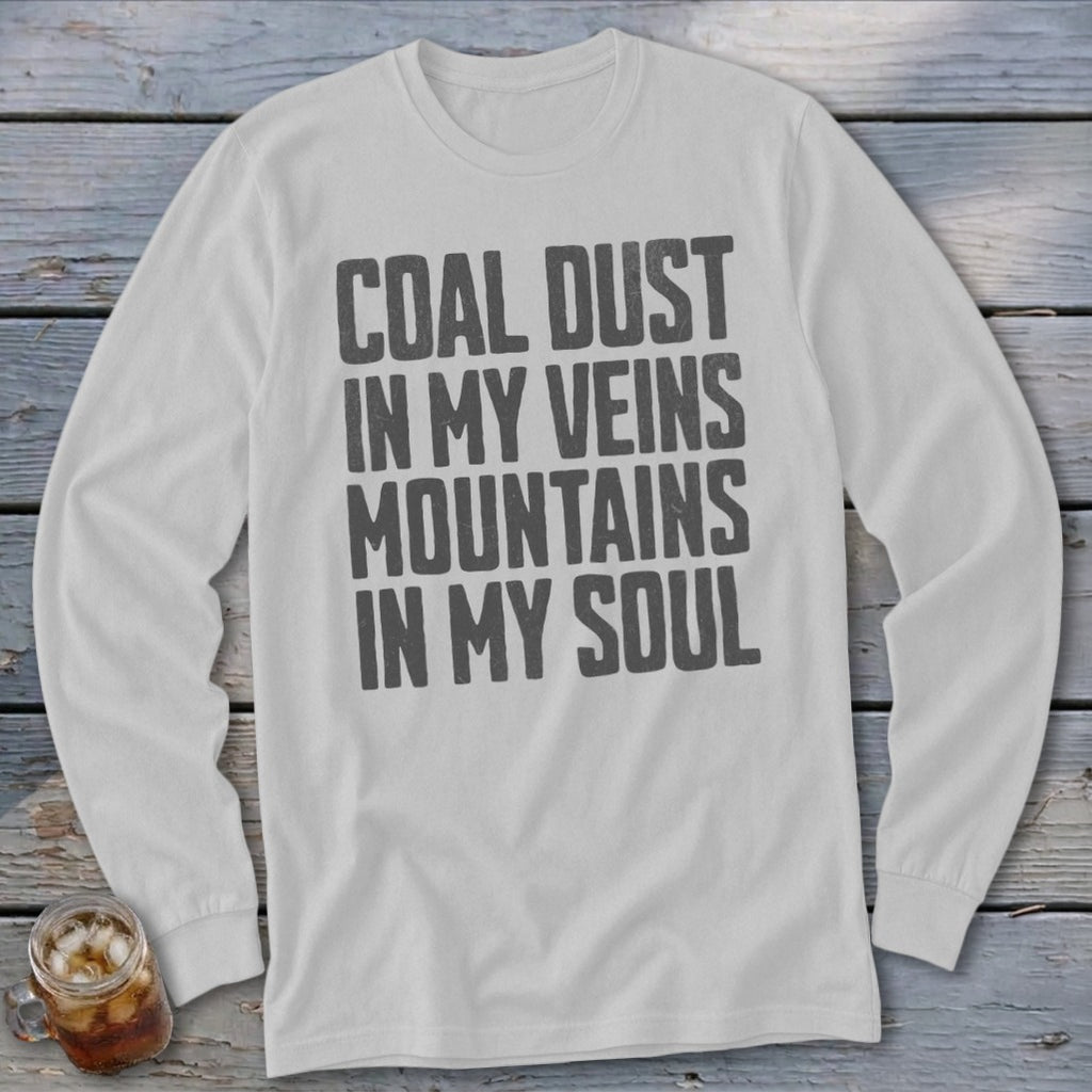 A light gray long-sleeve t-shirt with black distressed text reading COAL DUST IN MY VEINS MOUNTAINS IN MY SOUL.