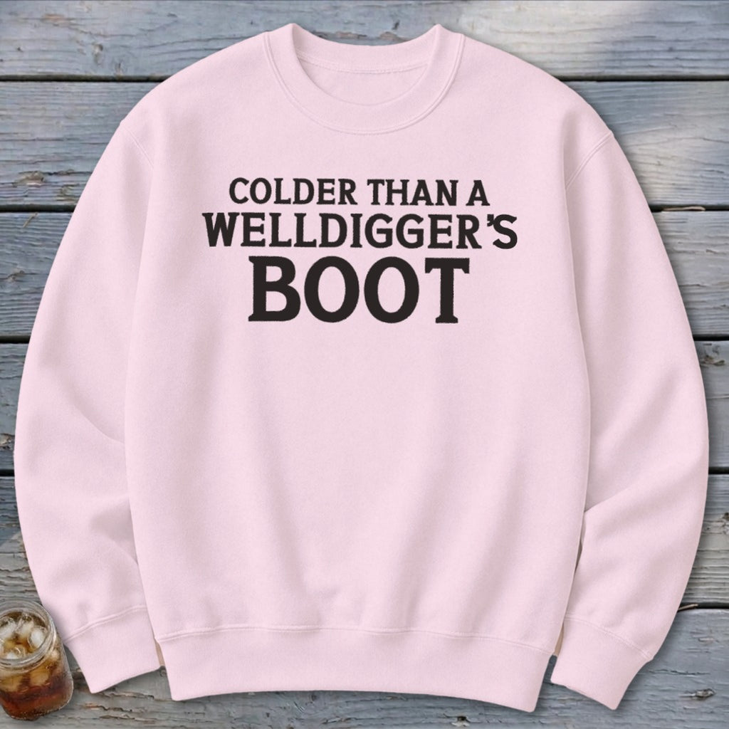 Pink sweatshirt with black text reading "COLDER THAN A WELLDIGGER'S BOOT".