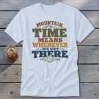 White t-shirt with "Mountain Time Means Whenever We Get There" text and clock graphic.