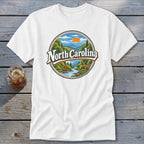 White t-shirt with circular North Carolina landscape graphic and deer.