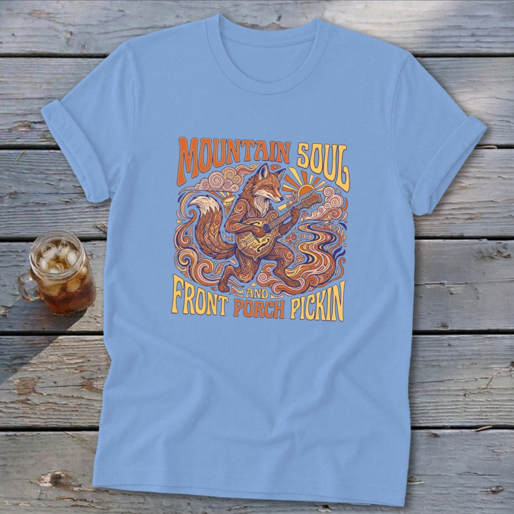 Light blue t-shirt with fox playing guitar, "Mountain Soul and Front Porch Pickin'" text.