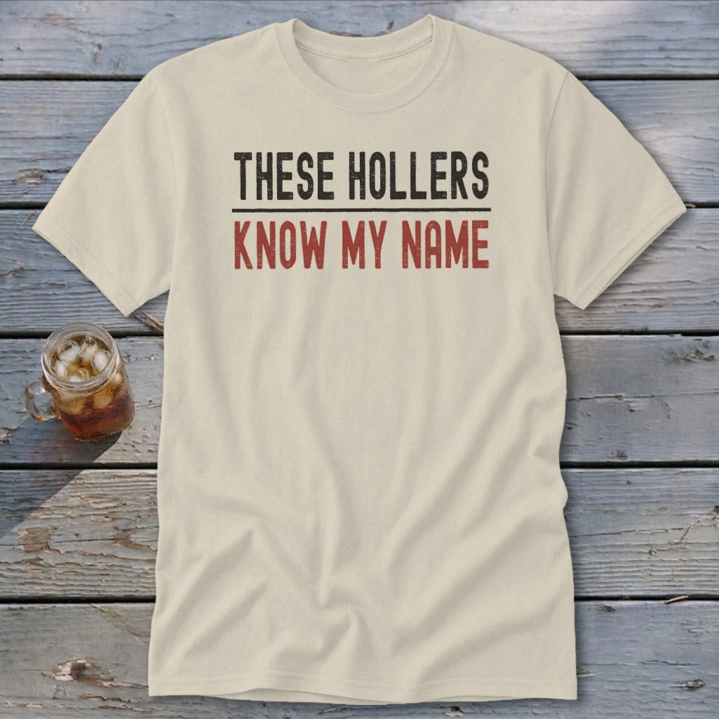 Light-colored t-shirt with "THESE HOLLERS KNOW MY NAME" text.