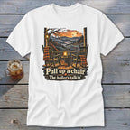 T-shirt with rocking chairs on porch, autumn scene, and text "Pull up a chair The holler's talkin'".