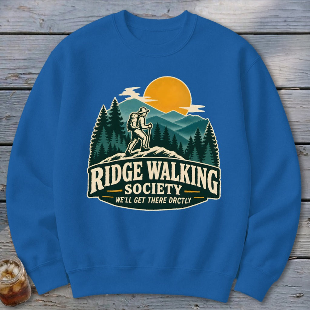 Blue sweatshirt with "Ridge Walking Society" graphic featuring a hiker and mountains.