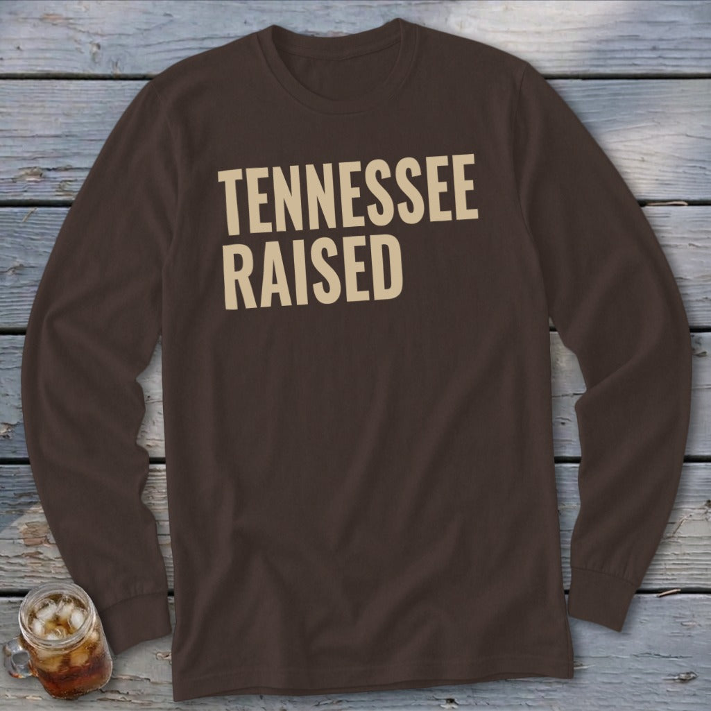 Brown long-sleeve shirt with "TENNESSEE RAISED" text in beige.
